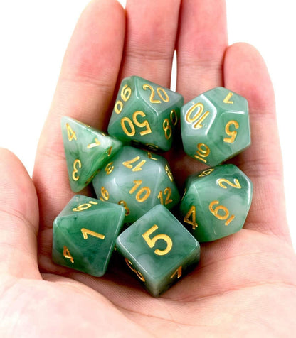 Jade green resin polyhedral D&D dice set with gold numbering